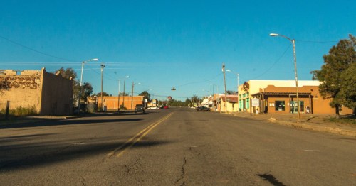 Looking down a main road in Mountainair, New Mexico, on a clear day.