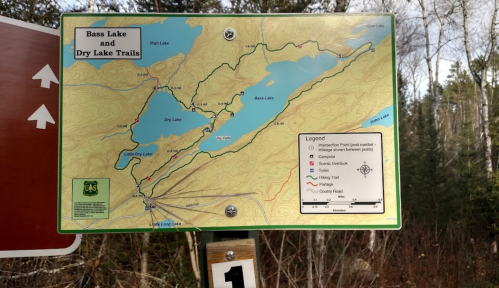 Map of Bass Lake and Dry Lake Trails, showing trails, lakes, and surrounding areas with a legend for navigation.