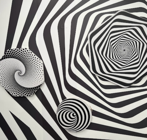Black and white spiral patterns on plates and wall, creating a dynamic optical illusion effect.