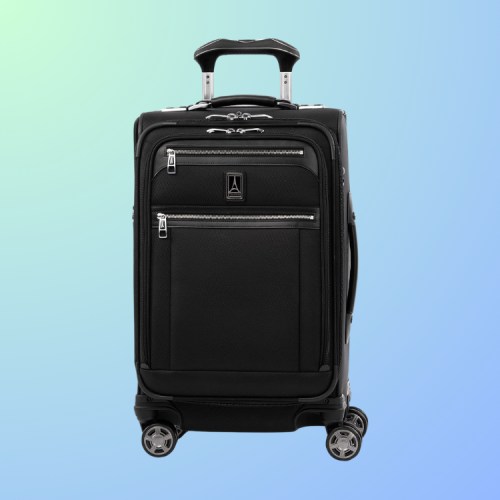 Black rolling suitcase with multiple zippered pockets on a gradient blue-green background.