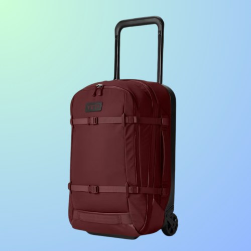 A maroon wheeled backpack with a retractable handle against a gradient background.