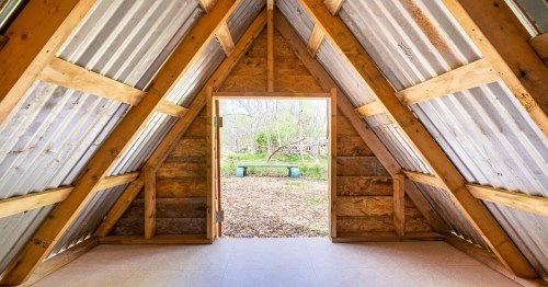 triangular wooden cabin-like structure