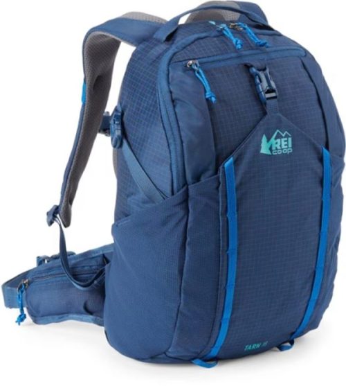 A blue REI Co-op Tarn 40 backpack with multiple compartments and adjustable straps, designed for outdoor activities.