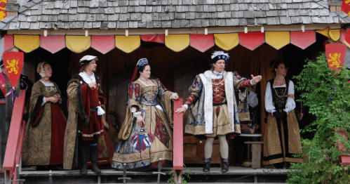 a king and queen and theyr court greet the audience that has gathered at the kansas city renaissance festival