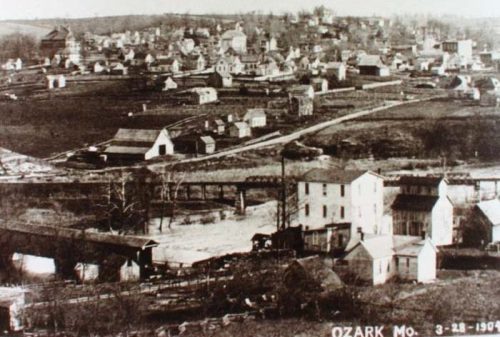 Historic black-and-white photo of Ozark, Missouri, taken on March 28, 1904, showing a rural town landscape.