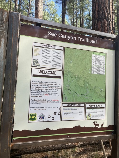 Trailhead sign for See Canyon, featuring a map and information on trail access, guidelines, and contact details.