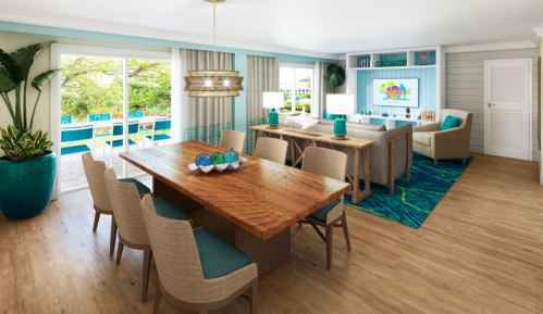 Bright, modern living space featuring a dining table, cozy seating area, and large windows with a view of greenery.