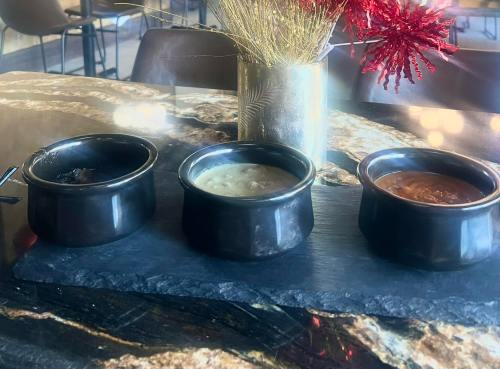A trio of soups - tomato, baked potato, and French onion - from Paris West in Wyoming.