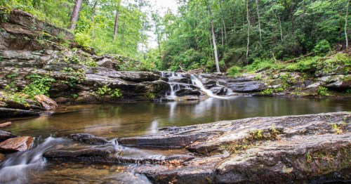 Water cascades over rocks at Devil's Den in Cheaha State Park, Alabama.