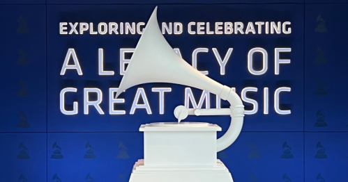 A large white gramophone sculpture in front of a blue wall with the text "Exploring and Celebrating a Legacy of Great Music."