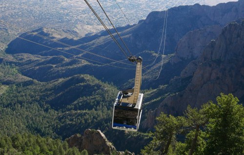 Gondola floating above scenic mountain