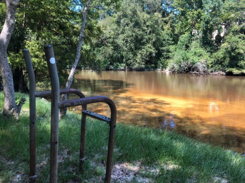 An old, abandoned lifeguard chair on the banks of the Bogue Falaya River in Covington, Louisiana