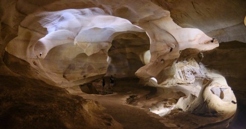 A wide, paved path winds its way through Longhorn Caverns in Texas.