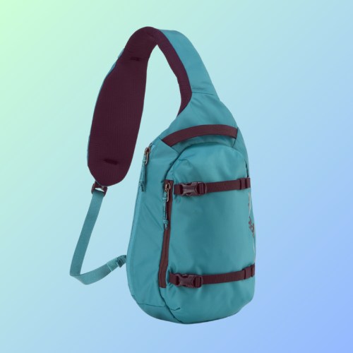 A teal sling backpack with a padded strap, featuring zippers and adjustable buckles, set against a gradient background.