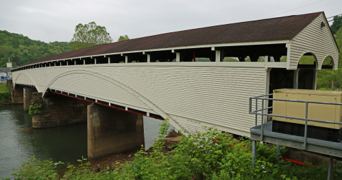 the long philippi covered bridge, the longest one inwest virginia, spanning a river