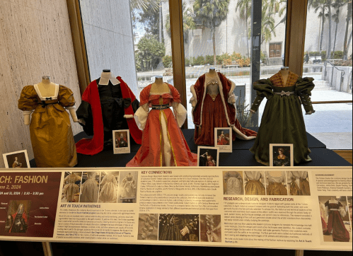 Display of historical dresses on mannequins, with informational panels about fashion design and fabrication.