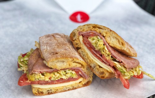 Sandwich from deli sitting on paper