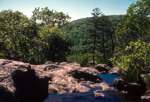 Scenic view from mountain top of green hills