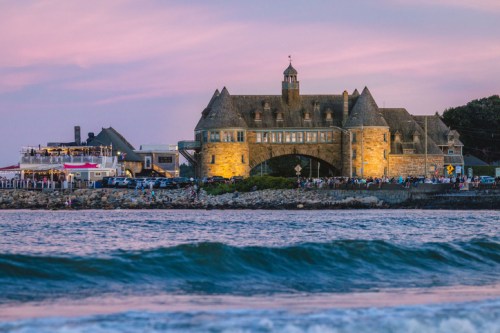The Coast Guard House Restaurant and The Towers at sunset in Narragansett, Rhode Island.