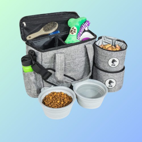 A gray pet bag with food containers, collapsible bowls, a toy, and a water bottle, set against a gradient background.