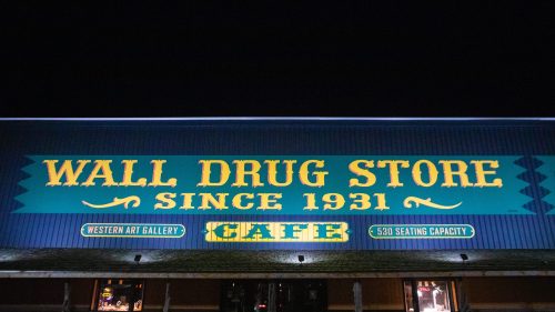 Exterior sign that says "Wall Drug Store"