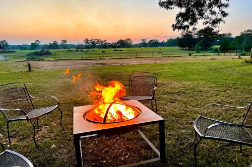 Burning fire pit with spectacular views of a gorgeous sunset.