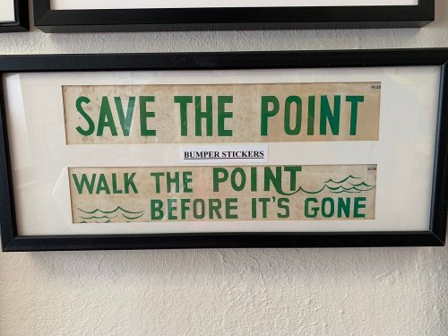 Framed bumper stickers reading "Save the Point" and "Walk the Point Before It's Gone" with wave graphics.
