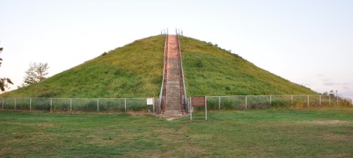 Staircase up the center of a fence-enclosed and grass-covered mound in Miamisburg, Ohio.