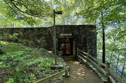 A stone structure housing a museum that matches the landscape completely and matches the surrounding area very nicely.