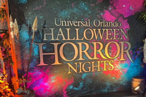 Colorful backdrop for Universal Orlando's Halloween Horror Nights, featuring the event's name in bold letters.