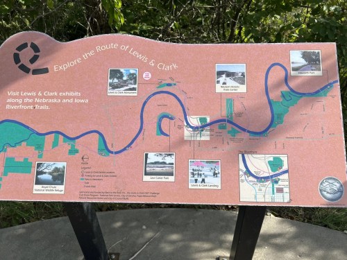 Sign displaying the route of Lewis & Clark with images of exhibits along the Nebraska and Iowa Riverfront Trails.