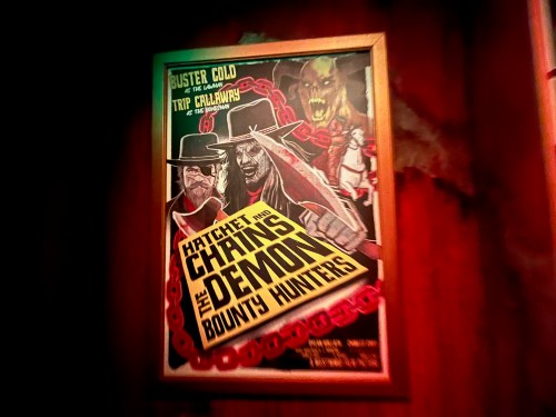 A vintage-style poster featuring two bounty hunters, titled "Hatchet and Chains: The Demon Bounty Hunters."