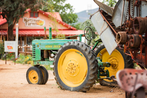 exterior of mortimer farms in arizona with a john deere tractor in foreground