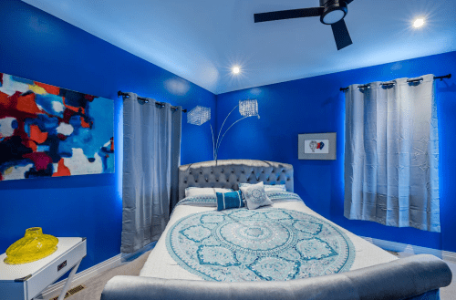 Blue master bedroom in converted church vacation rental in Denver, Colorado