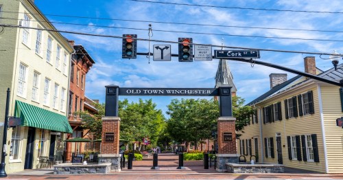 a photo of old town winchester virginia with street lights on cork street