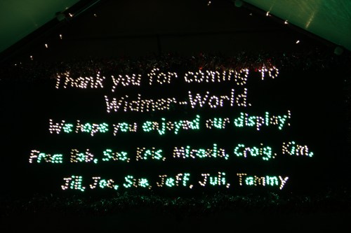 A colorful light display thanking visitors to "Winners World" and listing names of contributors.