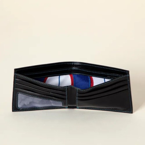 A black wallet opened to show multiple card slots and a colorful interior lining.