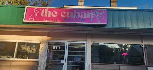 Sign for "The Cuban" restaurant in Savannah, GA, featuring a pink flamingo and palm tree design.