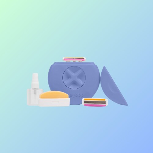 A purple grooming kit featuring a razor, replacement blades, a spray bottle, and a sponge on a gradient background.
