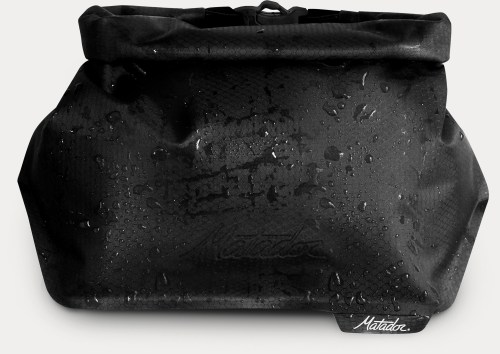 A black waterproof bag with a rolled top, featuring a subtle logo and droplets of water on its surface.