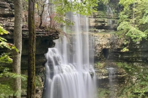 A curtain of water falling down the cliffside known as Virgin Falls.