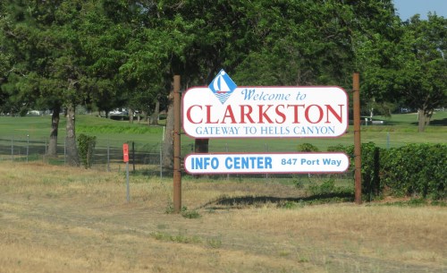 Welcome sign for Clarkston, labeled "Gateway to Hells Canyon," with an info center address below.