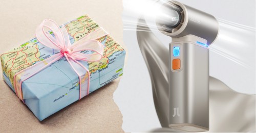 A wrapped gift with a map design next to a sleek, modern handheld device with a blue light.