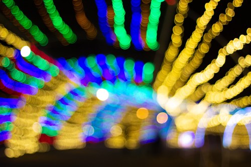 A vibrant display of colorful, blurred lights creating a festive atmosphere.