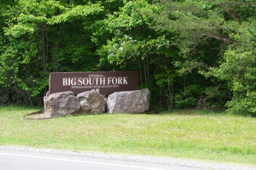 Sign marking the entrance to Big South Fork National River and Recreation Area, surrounded by greenery.