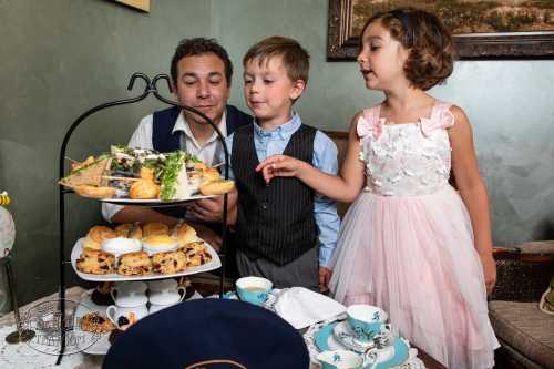 A boy and a girl enjoying teatime at St. James Tearoom in Albuquerque, New Mexico