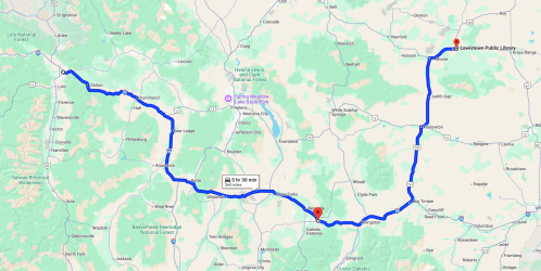 Map showing a route from a location near the Gallatin Gateway to Lewistown Public Library, with travel time indicated.