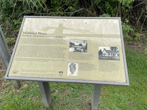 Sign titled "Wetland Ways" about Bob Beck, highlighting his contributions to preserving Port Penn traditions.