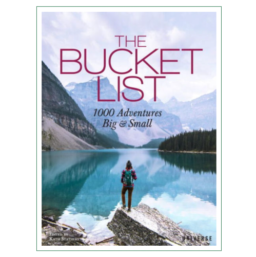 Book cover titled "The Bucket List: 1000 Adventures Big & Small," featuring a person by a serene lake surrounded by mountains.