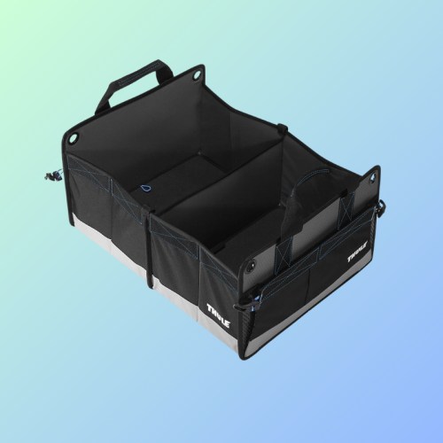 A black storage organizer with multiple compartments and handles, set against a gradient background.